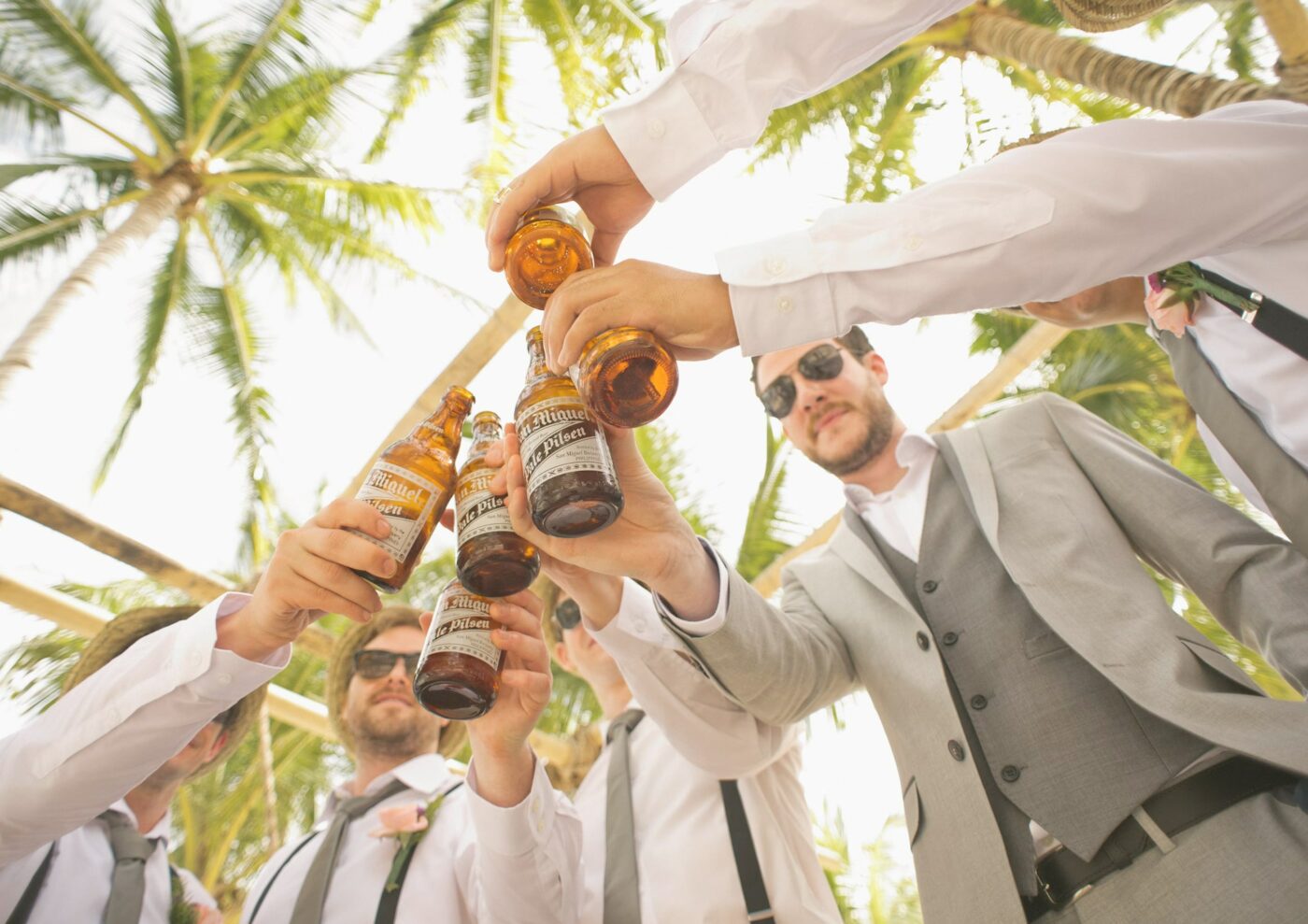 Men at a stag parting toasting their drinks