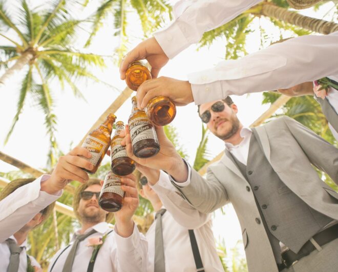 Men at a stag parting toasting their drinks