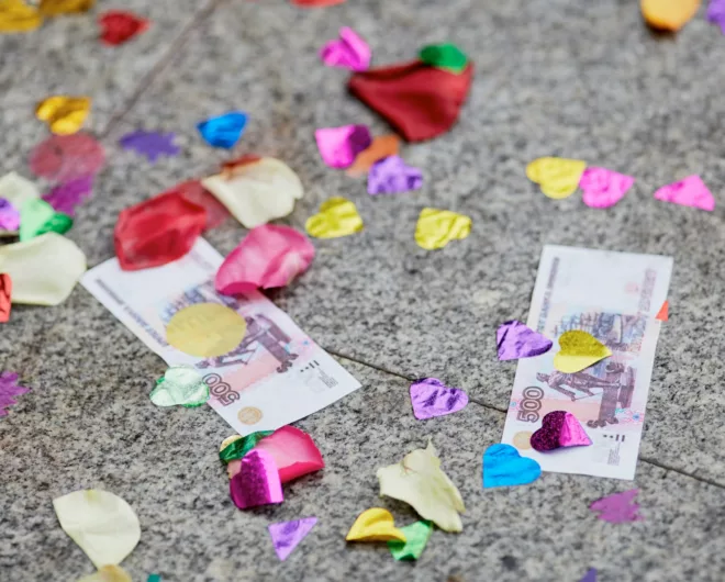 Money underneath multicoloured confetti