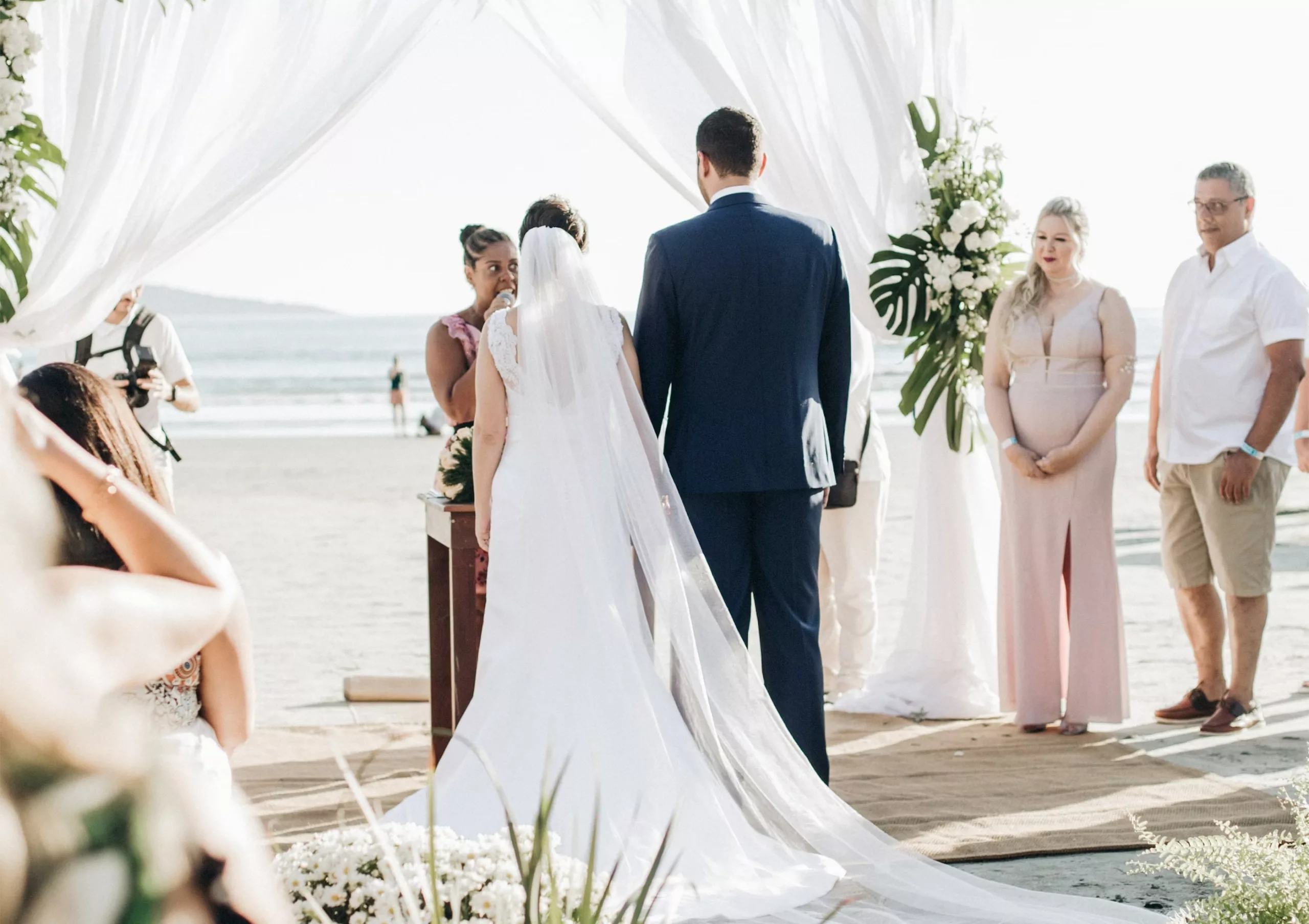 A groom and bride getting married on the beach